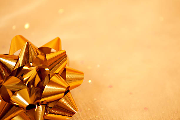 istock Christmas Gift Ribbon on Golden Background with Copy Space 183031455