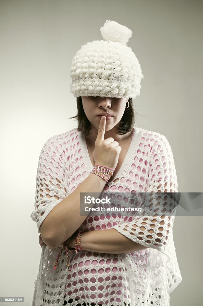 Crochet girl A young woman with a cute crochet hat covering her eyes. Adult Stock Photo