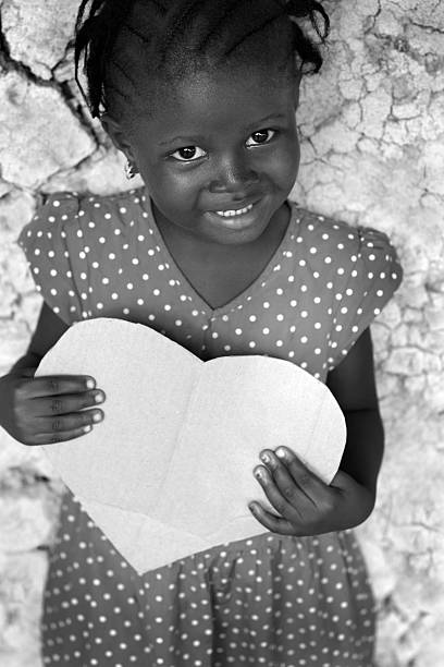 istock African Girl Holding Heart 183031665