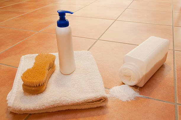 istock Wellness items and spilled bath-salt on brown terracotta tiled floor 183032268