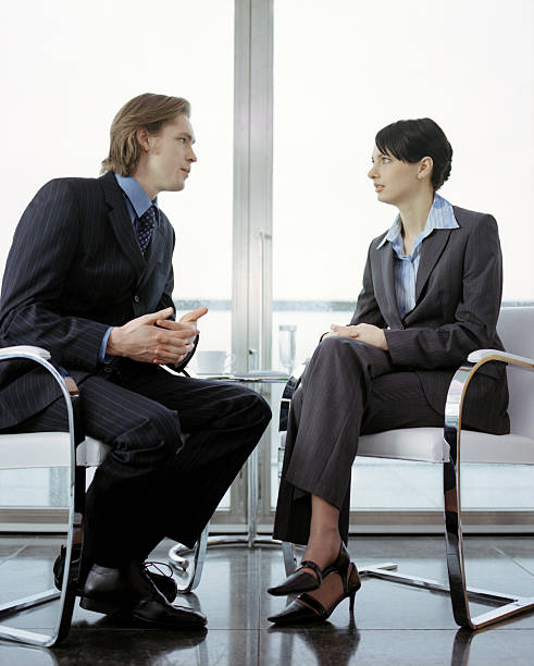 istock Business couple in discussion 183032378
