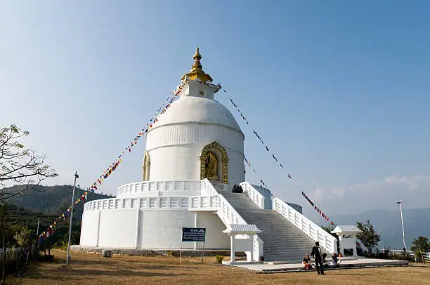 "Balanced on a narrow ridge high above Phewa Tal, the brilliant-white World Peace Pagoda in Pokhara is a massive Buddhist stupa which was constructed by Buddhist monks from the Japanese Nipponzan MyAhAji organisation. Besides being an impressive sight in itself, the shrine is a vantage point which offers spectacular views of the Annapurna range and Pokhara city."