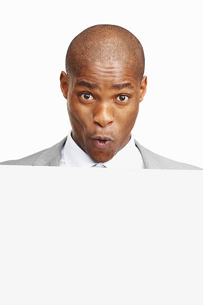 istock An excited business man holding a billboard against white background 183032710