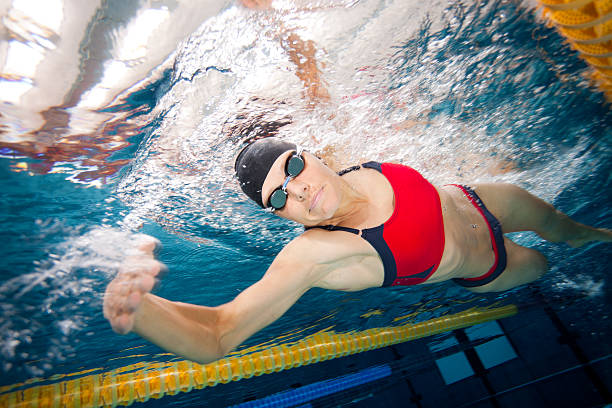 istock woman in bikini swimming front crawl 183032742