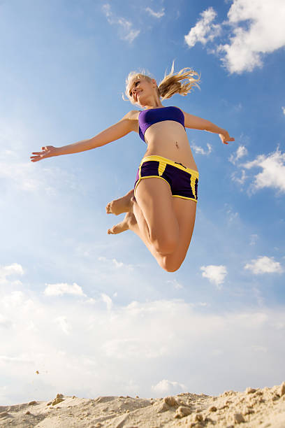 istock Young woman playing the sand. 183032881
