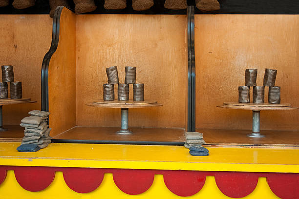 A carny tries to attract players to his water gun game at the Arizona State Fair in Phoenix.