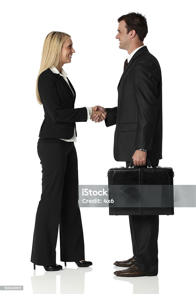 Business executives shaking hands Business executives shaking handshttp://www.twodozendesign.info/i/1.png White Background Stock Photo