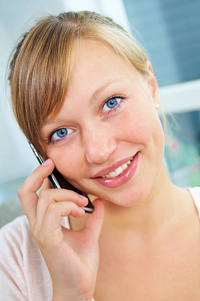 istock Beautiful young woman talking over her cellphone 183033049