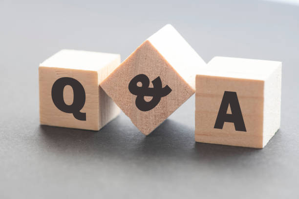 istock Q and A - acronym from wooden blocks with letters, Question and Answer concept, top view on white background 1830334303