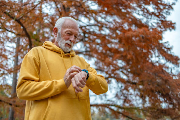 istock Senior man using smart watch measuring heart rate 1830340904