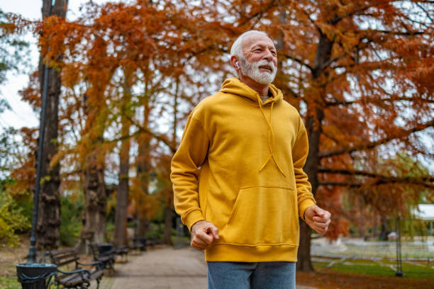 istock Senior male jogging in the park 1830341976