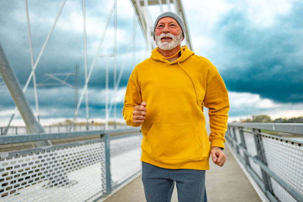 istock Senior man enjoys jogging outdoors. 1830343066