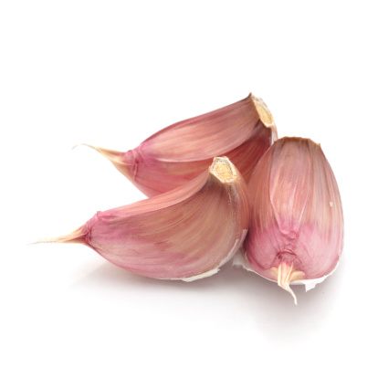 Three Cloves of Garlic isolated on a white background