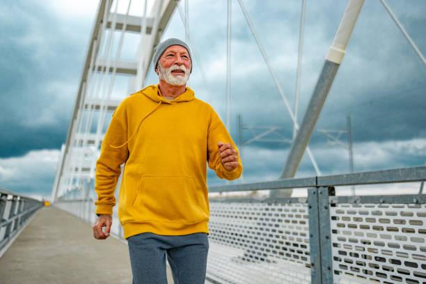 istock Male runner runs outside in cold morning. 1830343621