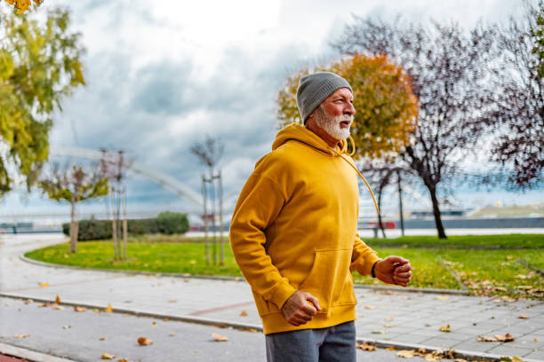istock Runner exercising on cloudy day and running in the park. 1830344710