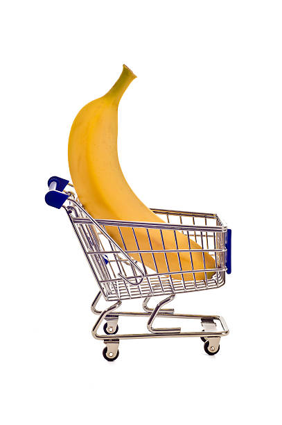 istock Giant Banana In Tiny Shopping  Cart 183034533