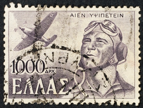 Greek postage stamp isolated on black