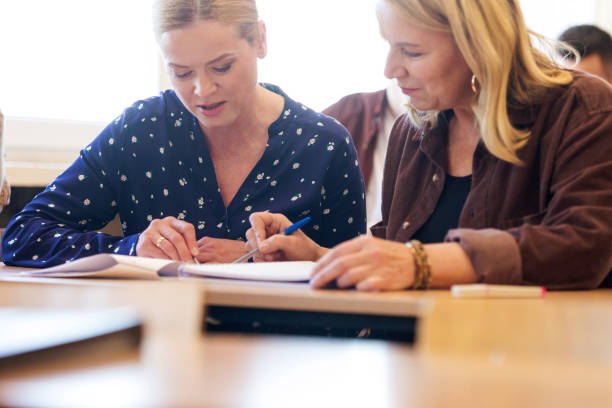 istock Female adult students during education training class 1830348554