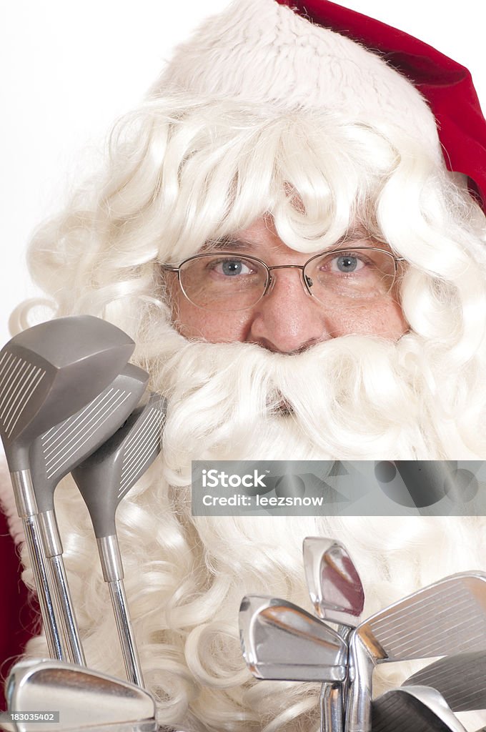 Golfing Santa - Sports Series Close up of Santa Claus with golf clubs.  Isolated on white.Click below to see a lightbox of all my Santa images: Golf Stock Photo