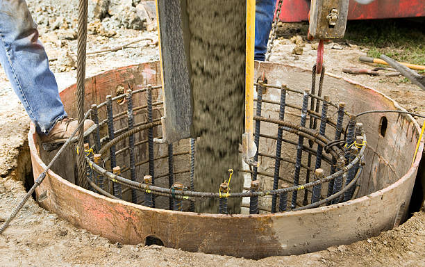 istock Concrete Pouring from Mixer into Wind Turbine Footing 183035513