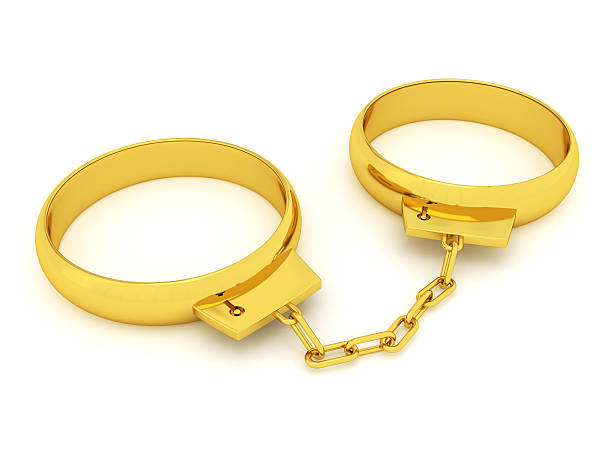 esposas de anillos de boda - golden handcuffs fotografías e imágenes de stock