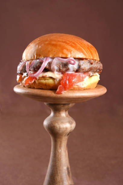 istock beef burger sandwich brioche bun with melted cheese, lettuce, tomato, mayonnaise and bread delicious fast food traditional snack 1830359380