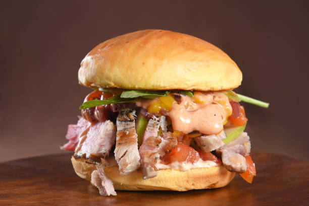 istock beef burger sandwich brioche bun with melted cheese, lettuce, tomato, mayonnaise and bread delicious fast food traditional snack 1830359892