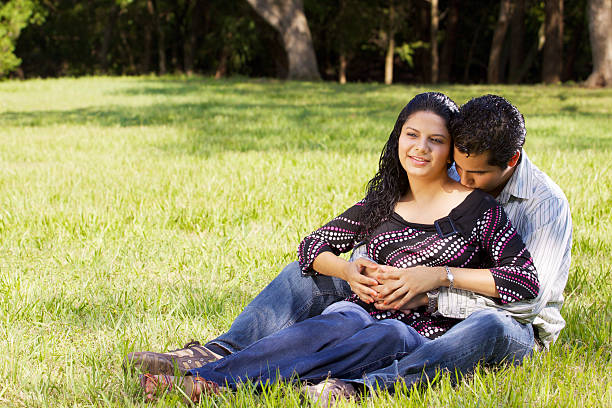 Happy couple at park stock photo