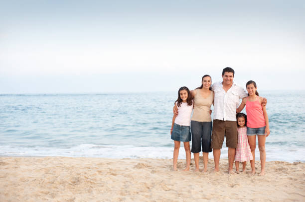 istock Happy family on the beach 183036063