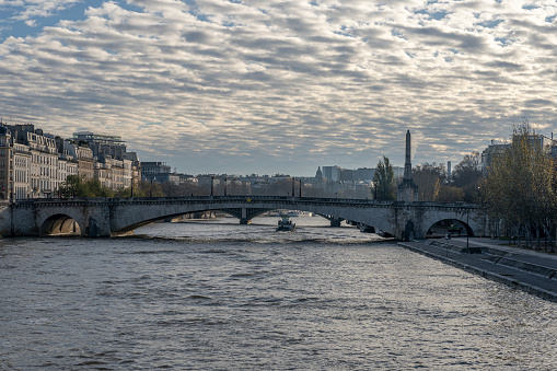 Paris, France - 11 30 2023: Quays of the Seine. View of Sully Bridge and The Seine river from Tournelle Bridge