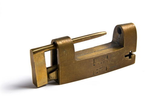 Vintage Chinese brass trunk lock / puzzle lock isolated on white