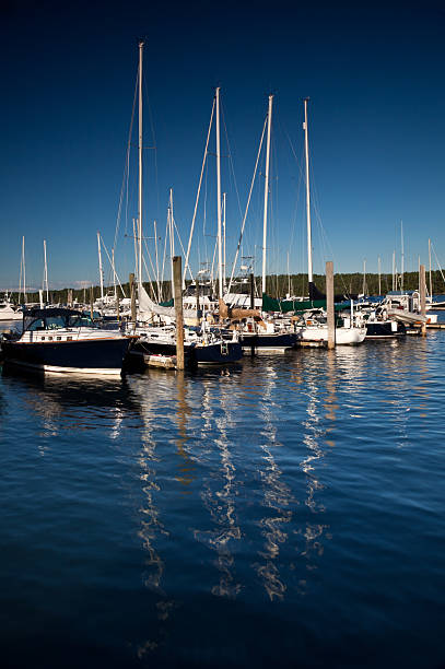 istock Sailboats at dock with a Moody Sunset 183036608