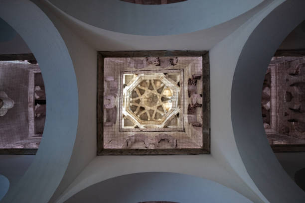 Toledo, Spain - March 17, 23: Ceiling with the arches and vaults of the naves of the hermitage or church of Cristo de la Luz, formerly the Bab al-Mardum mosque in Toledo, Spain. Spain Tourism techo con los arcos y bóvedas de las naves de la ermita o iglesia del cristo de la luz, antigua mezquita de bab al-mardum en toledo, españa. españa turismotecho con los arcos y bóvedas de las naves de la ermita o iglesia del cristo de la luz