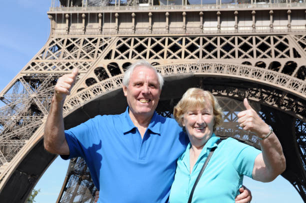 istock Senior couple in front of Eiffel Tower 183037038
