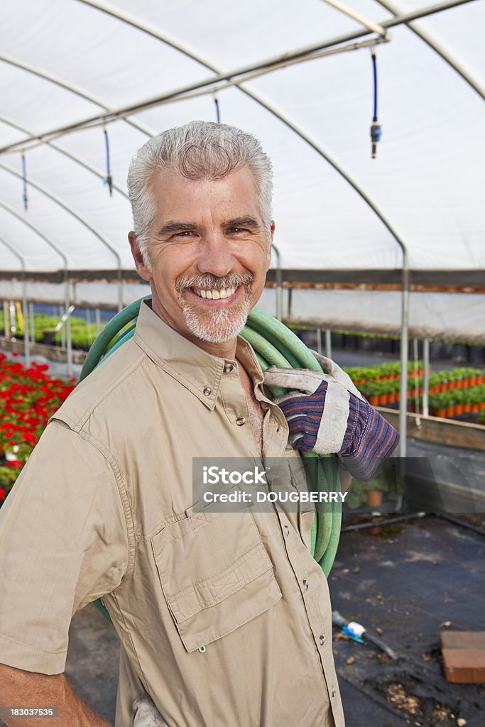 Homem em estufa - Foto de stock de 50-54 anos royalty-free