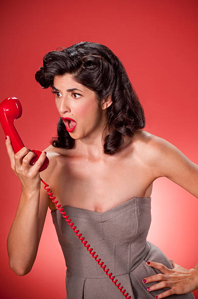 レトロな女性に電話 - kitsch telephone women old fashioned ストックフォトと画像