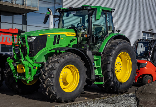 Reykjavik, Iceland - September 25, 2023: A brand new green John Deere agricultural tractor parked outdoors.