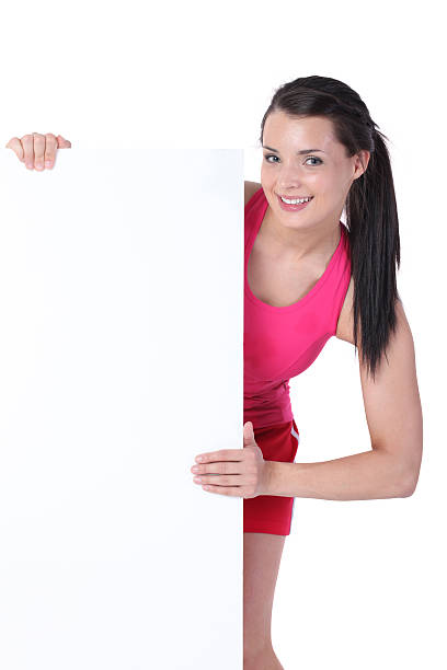 istock Woman peeking from behind a placard 183038264