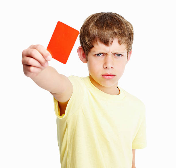 istock Angry kid showing red card isolated against white background 183038278