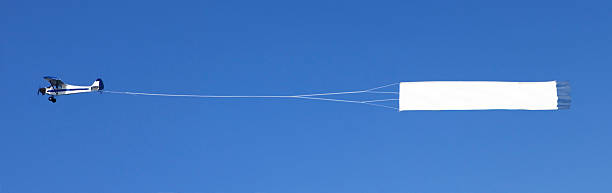 istock Airplane towing a blank banner 183038287