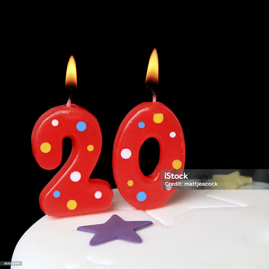 20th Birthday candles Red Birthday candles against black background Anniversary Stock Photo