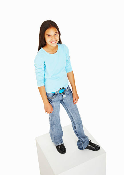 istock Cute little female standing on cube 183038717