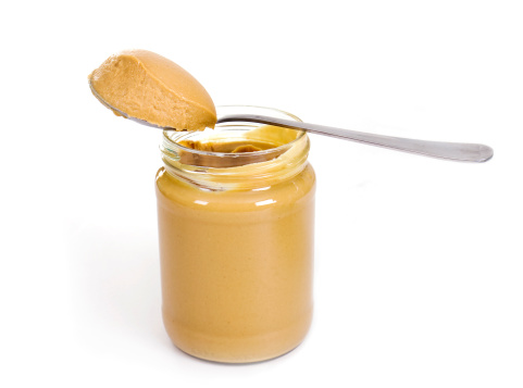 peanut butter in the jar with spoon