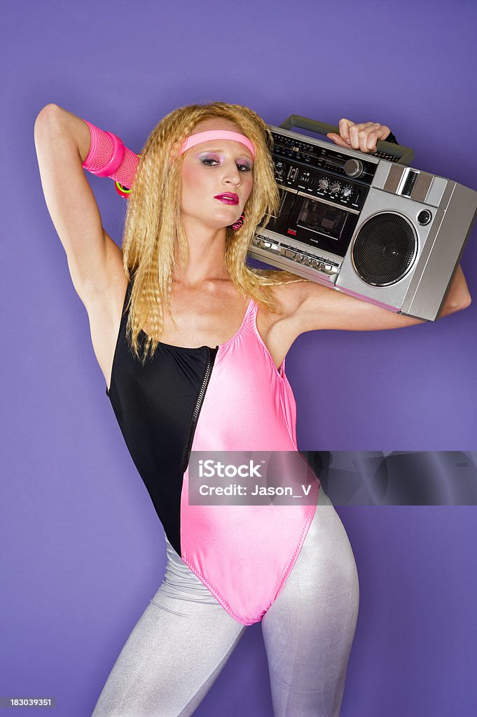 80's girl and a ghetto blaster An 1980's styled woman with crimped hair holding a boom box.  Taken with a ringflash for effectClick for Similar Pictures in My Music & Dance Lightbox 1980-1989 Stock Photo