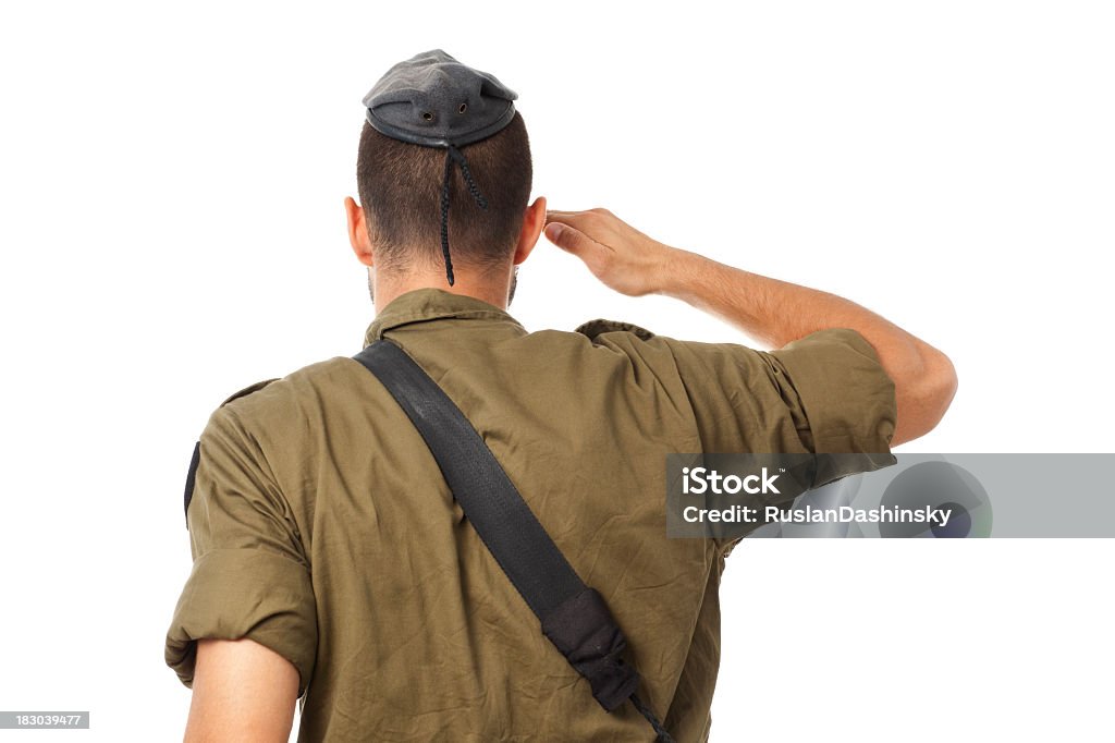 Israeli soldier saluting - gesture of respect. Israeli soldier saluting. Head and shoulders composition, rear view, isolated on white background. Israeli Military Stock Photo