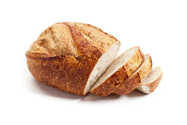 Fresh sourdough bread sliced on white background