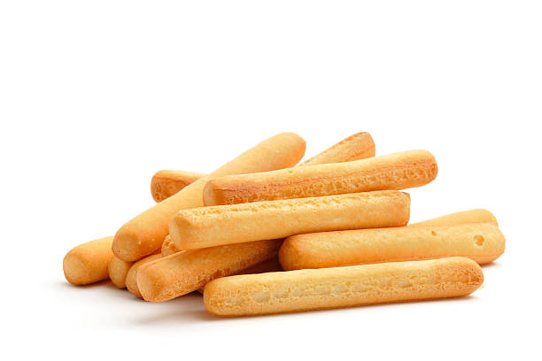 Mini Bread-sticks A small pile of breadsticks isolated on white. breadstick stock pictures, royalty-free photos & images