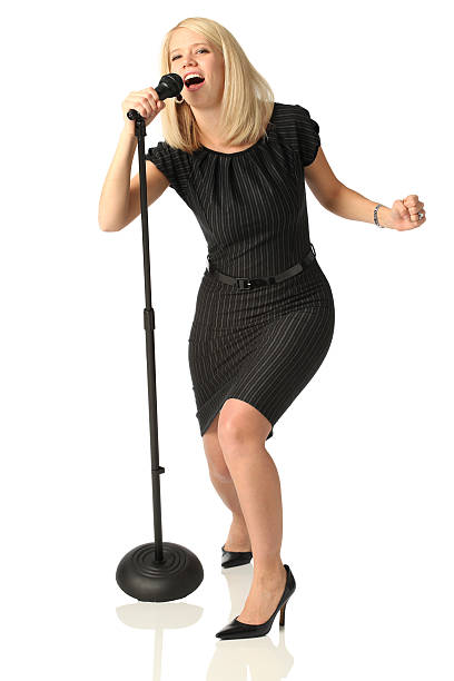 istock Woman singing into microphone 183039616
