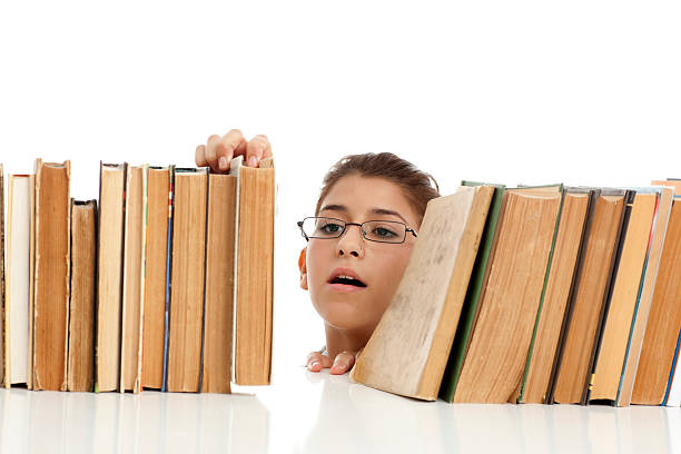istock Student girl found a book that sought. 183039625