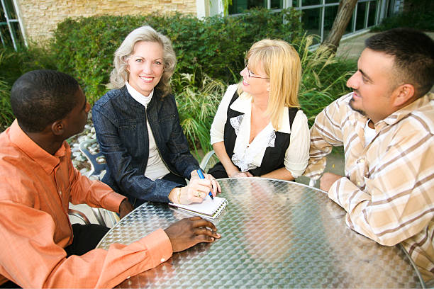 istock Diverse Group of Co-Workers Looking at Senior Leader 183039900
